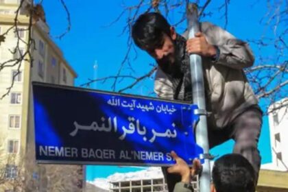 The street sign bearing the name of a Saudi Shiite cleric being installed in Iran, in 2016