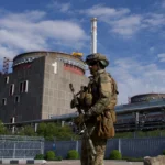 A Russian soldier patrols outside the Zaporizhzhia Nuclear Power Plant in Ukraine on May 1, 2022. Credit: Andrey Borodulin/AFP via Getty Images.