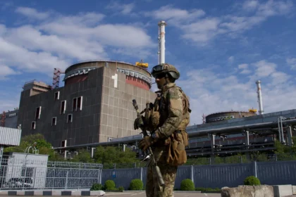 A Russian soldier patrols outside the Zaporizhzhia Nuclear Power Plant in Ukraine on May 1, 2022. Credit: Andrey Borodulin/AFP via Getty Images.