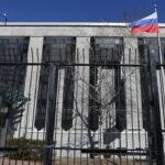 A flag is pictured outside the Russian embassy in Ottawa, Ontario, Canada