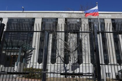 A flag is pictured outside the Russian embassy in Ottawa, Ontario, Canada
