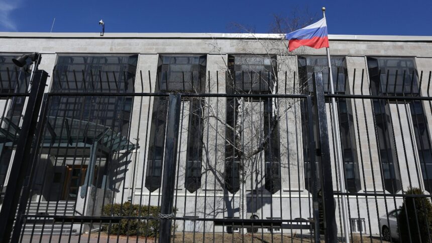 A flag is pictured outside the Russian embassy in Ottawa, Ontario, Canada