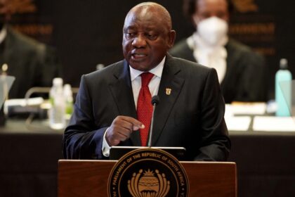 South African President Cyril Ramaphosa delivers his State of the Nation (SONA) address at the opening of the parliament in Cape Town, South Africa, 10 February 2022. – South African President Cyril Ramaphosa delivers a State of the Nation address on Thursday facing demands for a master plan to reverse widening disillusionment with his government. (Photo by Nic BOTHMA / POOL / AFP)