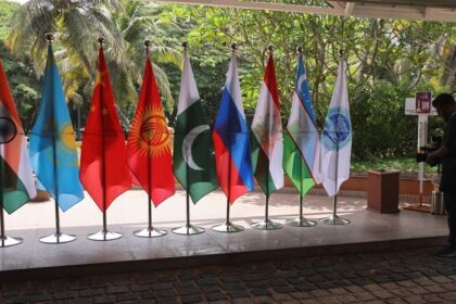 A video journalist films flags of countries participating in the Shanghai Cooperation Organisation (SCO) foreign ministers’ meeting, outside the venue in Goa, India May 4, 2023. REUTERS/Francis Mascarenhas/File Photo