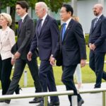 President Joe Biden walks alongside British Prime Minister Rishi Sunak, European Commission President Ursula von der Leyen, Canadian Prime Minister Justin Trudeau, Japan's Prime Minister Fumio Kishida, Italian Premier Giorgia Meloni, European Council President Charles Michel, French President Emmanuel Macron and German Chancellor Olaf Scholz to a flower wreath laying ceremony at the Hiroshima Peace Memorial Park in Japan on Friday. Susan Walsh/Pool/AP