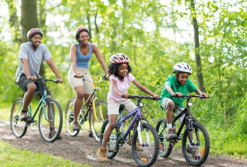 A family riding bicycles. Photo: Britannica