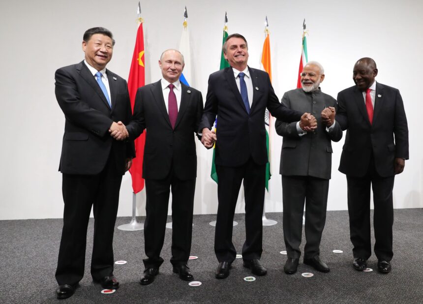 Chinese President Xi Jinping, Russian President Vladimir Putin, Brazilian President Jair Bolsonaro, India's Prime Minister Narendra Modi and South African President Cyril Ramaphosa pose during a BRICS meeting held during a G20 summit in Osaka in June 2019.
