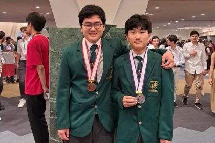 Team South Africa medal winners, left, brothers Minkyum Kim (bronze) and Youkyum Kim (silver), which they won at the International Mathematics Olympiad (IMO) in Japan this month. Picture: Supplied