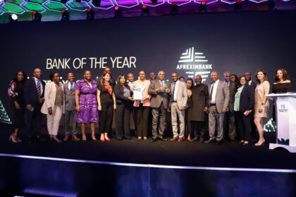 Prof. Benedict Oramah, President and Chairman of the Board of Directors at Afreximbank (in grey suit, holding an award), leads senior staff in receiving the two awards won by Afreximbank at the African Banker Awards ceremony held in Nairobi