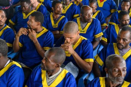 Marcel Malanga (centre, second row) sits among other accused of a failed coup attempt at the Ndolo Prison in Kinshasa / Photo: AFP