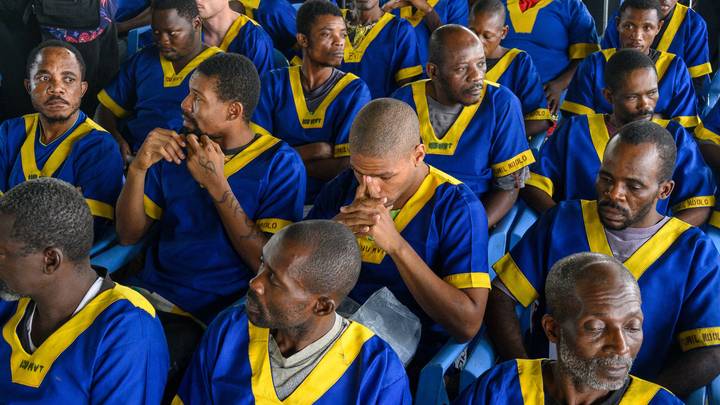 Marcel Malanga (centre, second row) sits among other accused of a failed coup attempt at the Ndolo Prison in Kinshasa / Photo: AFP