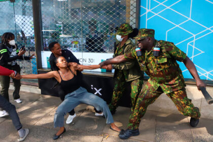 Police officers arrest a demonstrator protesting against proposed tax hikes in a finance bill that is due to be tabled in parliament in Nairobi, Kenya, Tuesday, June 18, 2024. Andrew Kasuku/AP