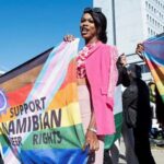 People hold banners in support of LGBTQ rights outside the high court which made a landmark ruling in favour of LGBTQ communities in Windhoek, Namibia, June 21, 2024 REUTERS/Opas Onucheyo