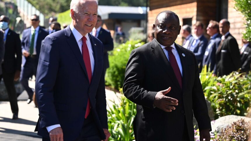 President Joe Biden talks with South Africa's President Cyril Ramaphosa as they arrive for a working session during the G7 summit in Carbis Bay, Cornwall, Britain, on June 12, 2021. REUTERS/Leon Neal