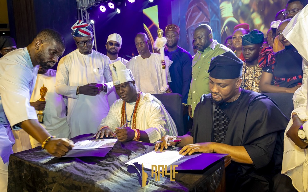 Ooni of Ife and DG of SMEDAN signing the 1 Billion Naira fund for WOMB Initiative