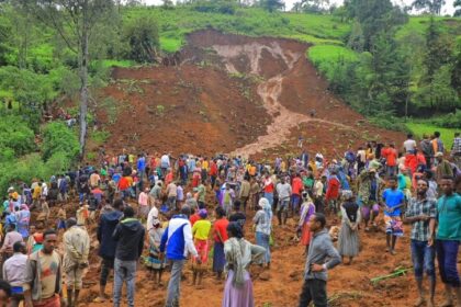 People standing at the bottom of a landslide that occurred in the Geze-Gofa district of Ethiopia on Tuesday.Gofa Zone Government Communication Affairs Department via AFP - Getty Images / AFP - Getty Images