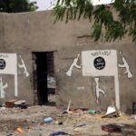 Islamic State flag emblazoned on a wall