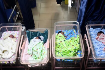 Newborn babies sleep in cots at a maternity center in Lagos, Nigeria, on Oct. 14, 2022.