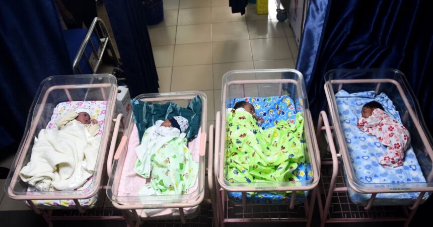Newborn babies sleep in cots at a maternity center in Lagos, Nigeria, on Oct. 14, 2022.