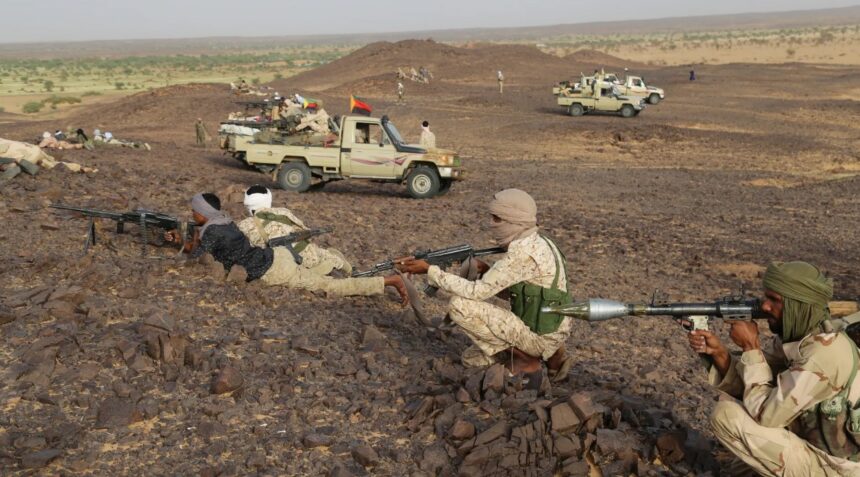 Tuaregs fighters near pick up trucks with machine gun near Kidal, northern Mali on September 28, 2016. [File/AFP]