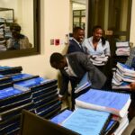 Ugandan human rights advocates arrange documents, during the filing of an appeal against a ruling by a lower court that upheld a draconian anti-homosexuality law which includes the death penalty for certain same-sex acts, at the Supreme court in Kampala, Uganda, July 11, 2024. REUTERS/Abubaker Lubowa