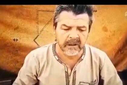 A screengrab of a video from the media foundation of Jama'a Nusrat ul-Islam wa al-Muslimin includes what appears to be on-camera statements by the two captives, who say they were working for a Russian company in southwest Niger when they were taken prisoner. (X/@ZagazOlaMakama)