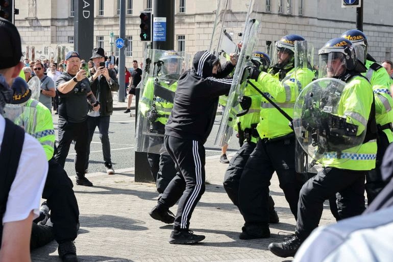 Protester and Police during the protest in the United Kingdom.