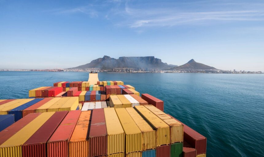 A ship loaded with containers approaching Cape Town in South Africa.