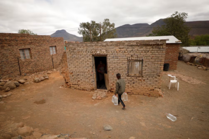 Township residents carry bottles collected from a municipal water tanker in drought-stricken Graaff-Reinet, South Africa on November 17, 2019. PHOTO | REUTERS