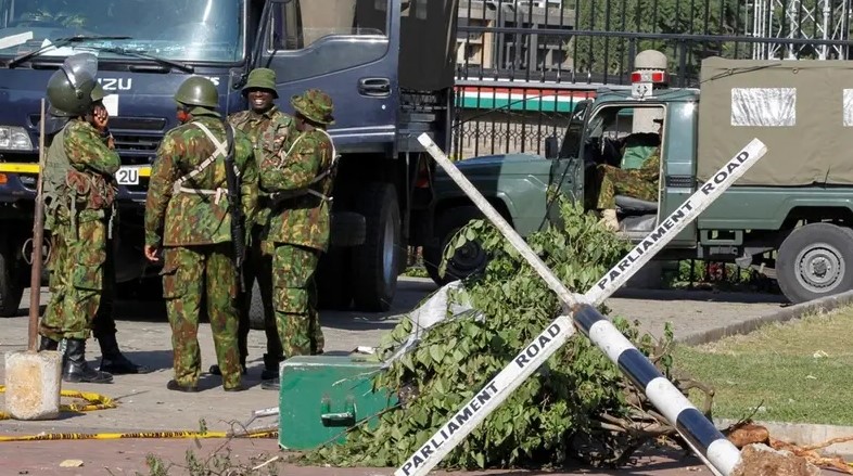 Police officers stand outside the Parliament building in Nairobi, Kenya, June 26, 2024. (Reuters)