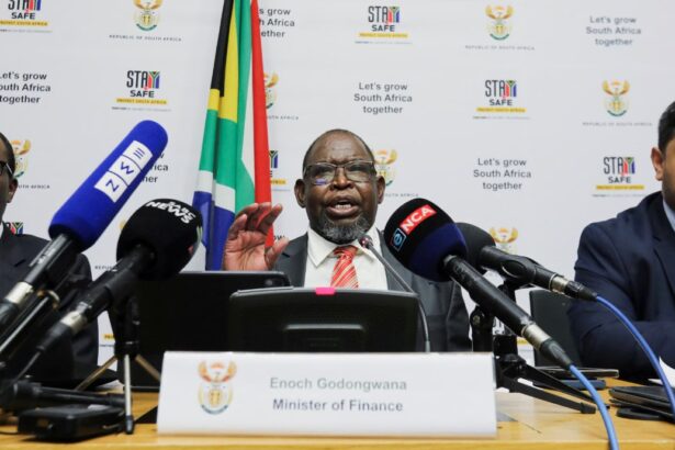 South Africa's Finance Minister Enoch Godongwana flanked by his deputy ministers David Masondo, and Ashor Nick Sarupen, speaks at the press conference ahead of his 2024 medium-term budget policy statement in Cape Town, South Africa, October 30, 2024. REUTERS/Shelley Christians