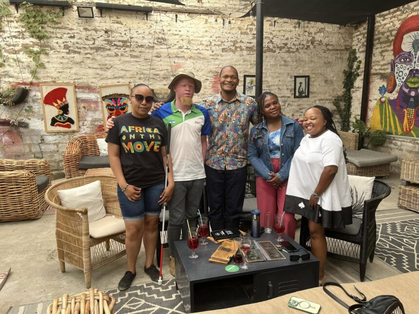 Mandela Washington Fellowship alumni and Aanu Omoleye, a Deaf Nigerian intern, meet at the U.S. Embassy in Maseru to discuss disability support in Lesotho.