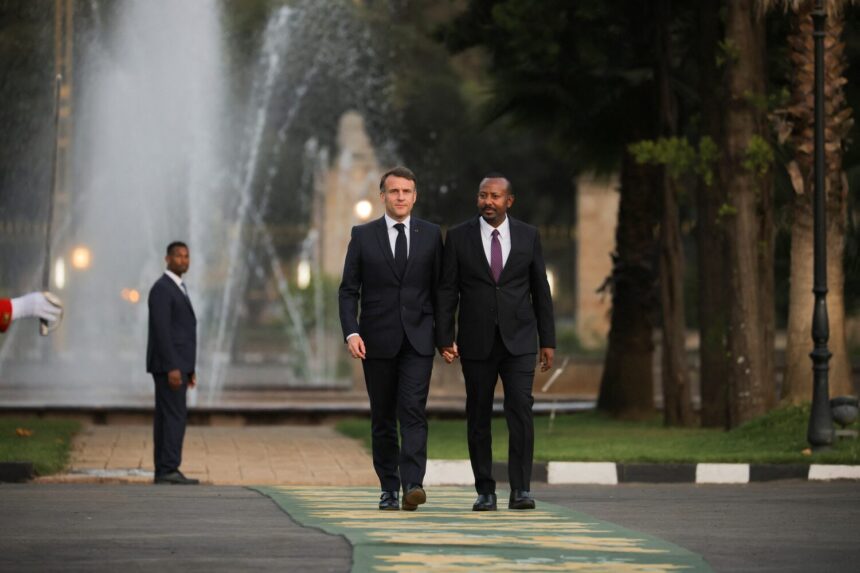 French President Emmanuel Macron and Ethiopian Prime Minister Abiy Ahmed arrive at the National Palace ahead of their joint news conference in Addis Ababa, Ethiopia, December 21, 2024. REUTERS/Tiksa Negeri