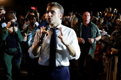French President Emmanuel Macron speaks to the local residents during his visit in Pamandzi, on the French Indian Ocean territory of Mayotte on December 19, 2024. Ludovic Marin/AFP/Getty Images
