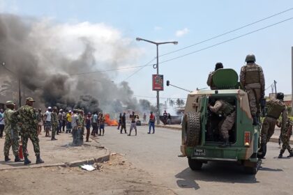 Mozambican police officers arrive in an armoured vehicle during a protest this month in the capital, Maputo. Photograph: Amilton Neves/AFP/Getty Images