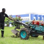 Engineers at the MUBAS UniPod work on a locally-made tractor, a key component of the government's plan to boost agricultural mechanization.