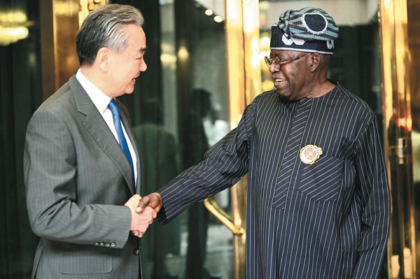 China's Minister of Foreign Affairs of China, Wang Yi and President Bola Tinubu of Nigeria