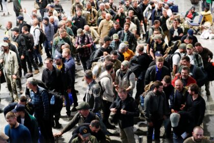 Romanian mercenaries queue to undergo screening as they are evacuated from Goma in the eastern Democratic Republic of Congo (DRC) amid a conflict between M23 rebels and the Armed Forces of the Democratic Republic of the Congo (FARDC), at the Grande Barrier border crossing, as seen from Gisenyi side of Rwanda, January 29, 2025. REUTERS/Thomas Mukoya