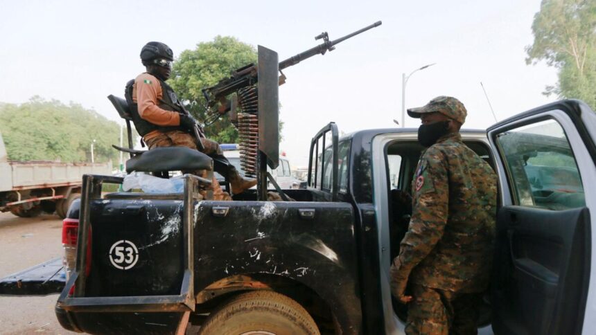 A soldier sits on one of the trucks used to bring back the girls who were kidnapped from a boarding school in the northwest Nigerian state of Zamfara, following their release in Zamfara, Nigeria. Reuters File Photo