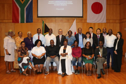 Japan’s Ambassador Shimizu Fumio with grant recipients in Pretoria, South Africa. Photo: Embassy of Japan.