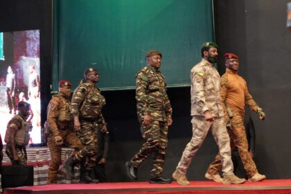 Heads of state of Mali's Assimi Goita, Burkina Faso's Captain Ibrahim Traore and Niger's General Abdourahamane Tiani walk together during the first ordinary summit of heads of state and governments of the Alliance of Sahel States (AES) in Niamey, Niger July 6, 2024. REUTERS/Mahamadou Hamidou/File Photo