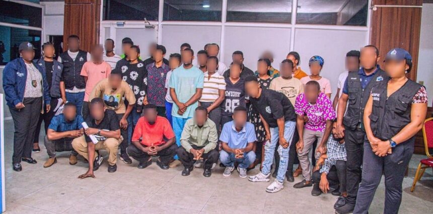 Rescued Ghanaian victims with Nigerian police officers at the INTERPOL NCB Abuja office before their handover to the Ghana High Commission.