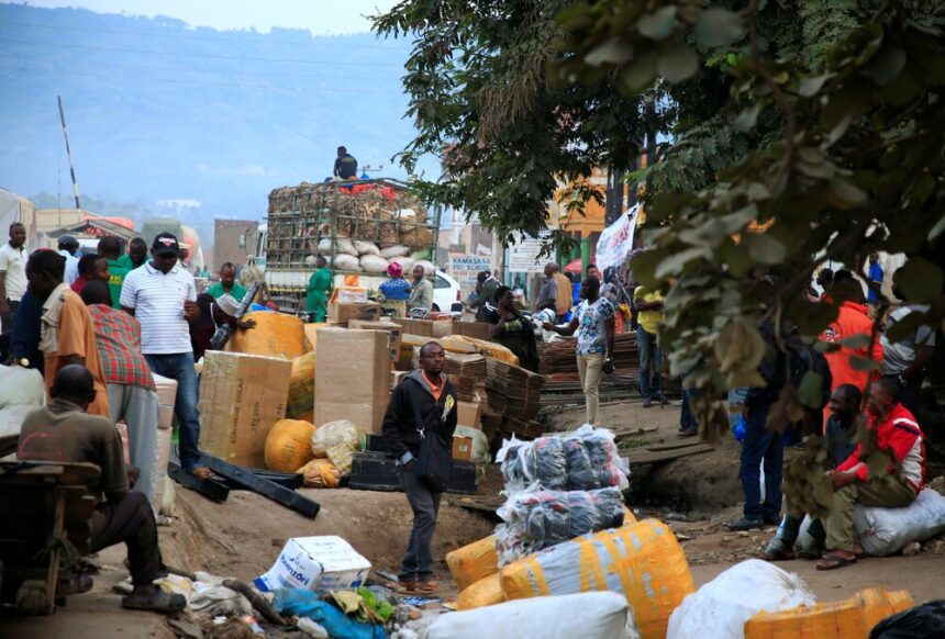 Ugandan business people are seen at a market with their merchandises for sale at Mpondwe border that separates Uganda and the Democratic Republic of Congo, in Mpondwe, Uganda, June 14, 2019. REUTERS/James Akena/ File Photo