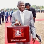 Uganda's Minister of Finance Matia Kasaija displays a briefcase carrying National Budget 2024/25 before presenting it to the nation during a budget speech at Kololo airstrip in Kampala, Uganda, June 13, 2024. REUTERS/Michael Muhati/File Photo