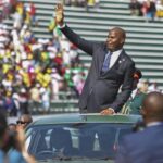 President Daniel Chapo waves to the crowd at the National Independence Stadium during Mozambique’s 50th independence celebrations, as citizens and regional leaders gather to mark the milestone.